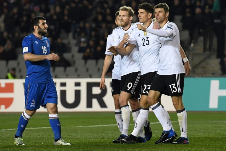 From L: Germany's Jonas Hector, Andre Schuerrle, Mario Gomez and Thomas Mueller celebrate a goal in Baku on March 26, 2017