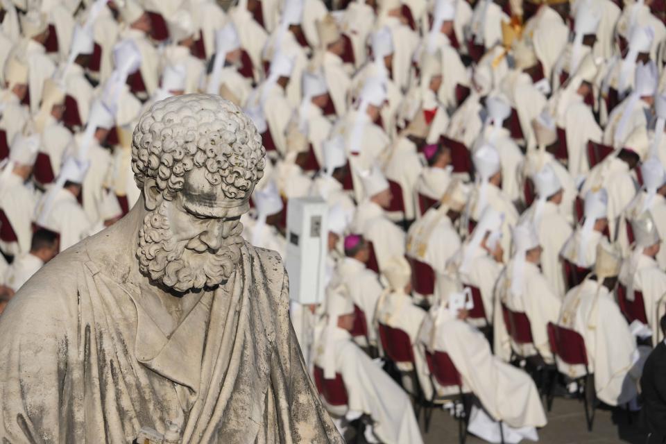 Prelates attend a mass presided over by Pope Francis and concelebrated by the new cardinals for the start of the XVI General Assembly of the Synod of Bishops in St. Peter's Square at The Vatican, Wednesday, Oct.4, 2023. Pope Francis is convening a global gathering of bishops and laypeople to discuss the future of the Catholic Church, including some hot-button issues that have previously been considered off the table for discussion. Key agenda items include women's role in the church, welcoming LGBTQ+ Catholics, and how bishops exercise authority. For the first time, women and laypeople can vote on specific proposals alongside bishops (AP Photo/Andrew Medichini)