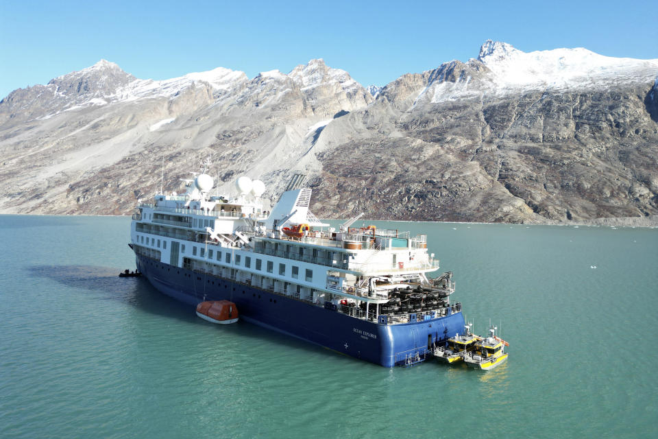 A view of the Ocean Explorer, a Bahamas-flagged Norwegian cruise ship with 206 passengers and crew, which has run aground in northwestern Greenland, on Tuesday, Sept. 12, 2023. The 104.4-meter (343-foot) long and 18-meter (60 foot) wide Ocean Explorer ran aground on Monday in Alpefjord in the Northeast Greenland National Park. It's the world’s largest and most northerly national park and is known for icebergs and the musk oxen that roam the coast. According to authorities no one on board was in danger and no damage has been reported. (SIRIUS/Joint Arctic Command via AP)