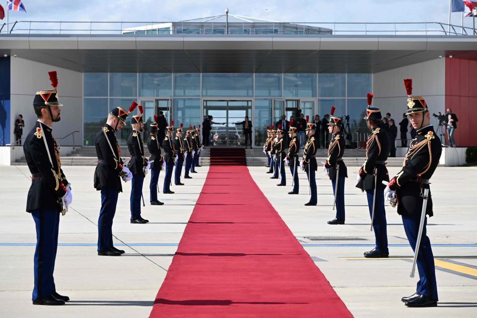 French Republican Guards stand beside the red carpet prior to the arrival of Britain's King Charles III and Britain's Queen Camilla (POOL/AFP via Getty Images)