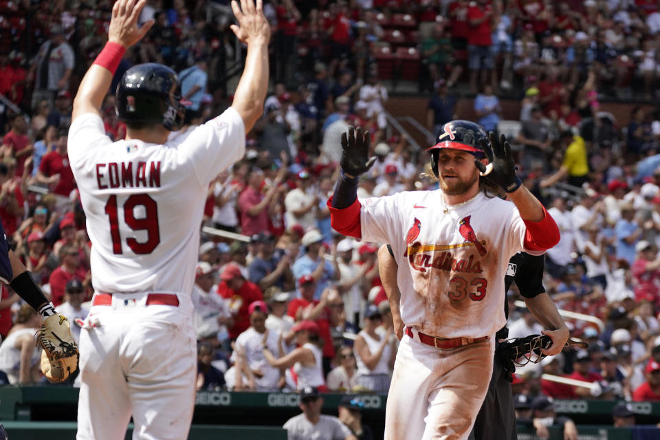 St. Louis Cardinals' Brendan Donovan (33) is congratulated by teammate Tommy Edman (19) after hitting a two-run home run during the seventh inning of a baseball game against the New York Yankees Sunday, July 2, 2023, in St. Louis. (AP Photo/Jeff Roberson)