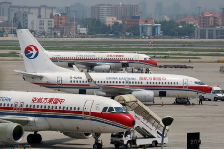 China Eastern Airlines planes are seen on the tarmac at Hongqiao International Airport in Shanghai, July 29, 2014. REUTERS/Aly Song