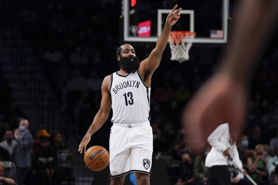 Brooklyn Nets' James Harden calls out to teammates during the first half of a preseason NBA basketball game against the Milwaukee Bucks on Friday, Oct. 8, 2021, in New York. (AP Photo/Frank Franklin II)