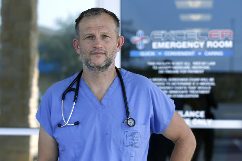 Dr. Nathaniel B. Ott, M.D. poses for a photo outside EXCELER emergency room Sunday, Sept. 1, 2019, in Odessa, Texas. Ott attended to one of Saturday's shooting outside his center. (AP Photo/Sue Ogrocki)