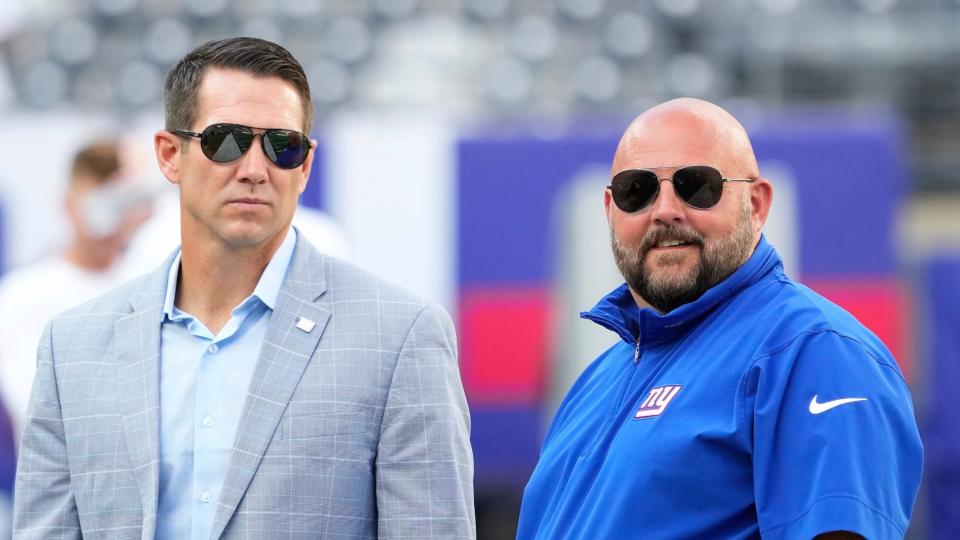 ew York Giants head coach Brian Daboll (right) and general manager Joe Schoen (left) talk before a game at MetLife Stadium.