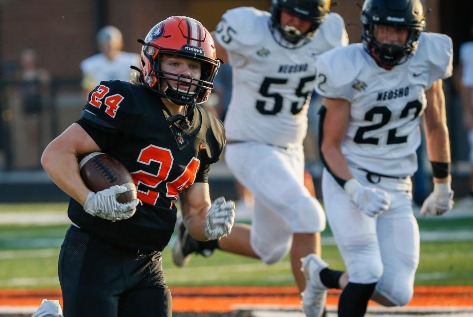 Connor Sandridge, of Republic, runs the ball during the Tigers 47-12 win over Neosho in the season opener at Republic High School on Friday, Aug. 27, 2021.