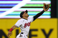 Cleveland Indians' Cesar Hernandez catches a fly ball hit by Tampa Bay Rays' Mike Zunino during the sixth inning of a baseball game Saturday, July 24, 2021, in Cleveland. (AP Photo/Tony Dejak)