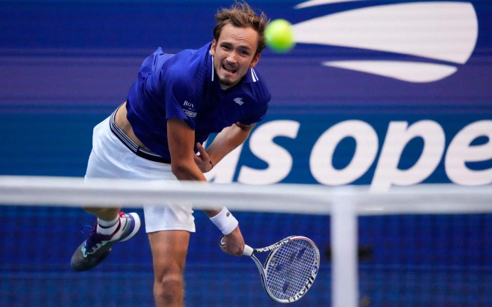 Russia's Daniil Medvedev hits a return to Canada's Felix Auger-Aliassime during their 2021 US Open Tennis tournament men's semifinal match - AFP