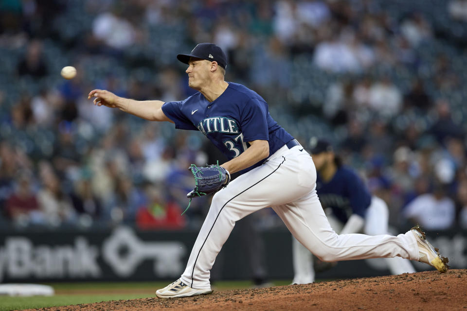 Seattle Mariners closing Paul Sewald throws to an Oakland Athletics batter during the ninth inning of a baseball game Thursday, May 25, 2023, in Seattle. The Mariners won 3-2. (AP Photo/John Froschauer)