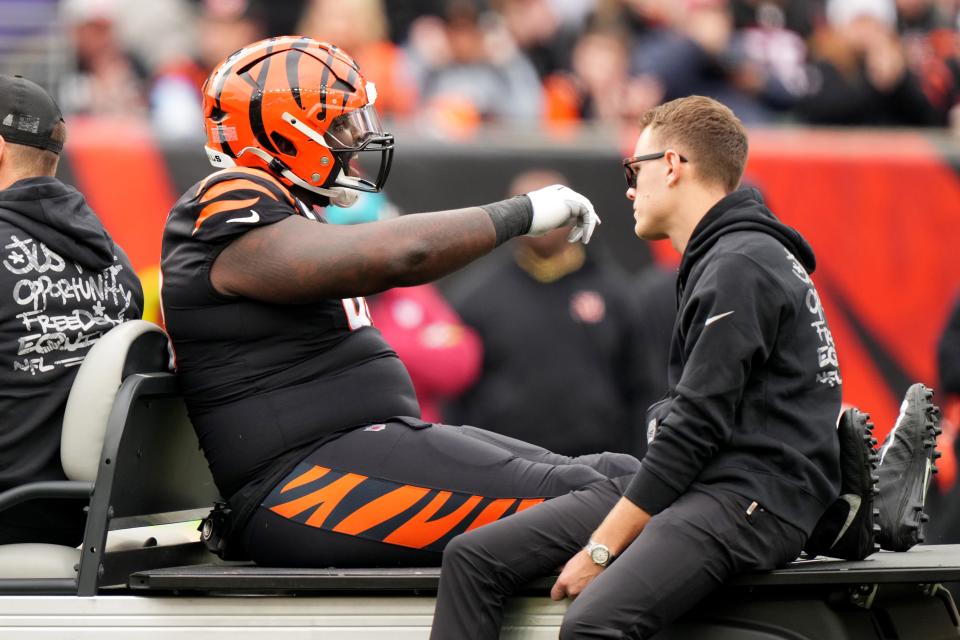 Cincinnati Bengals defensive tackle DJ Reader (98) encourages the team as he taken to the locker room after suffering an injury in the first quarter of a Week 15 NFL football game between the Minnesota Vikings and the Cincinnati Bengals, Saturday, Dec. 16, 2023, at Paycor Stadium in Cincinnati.