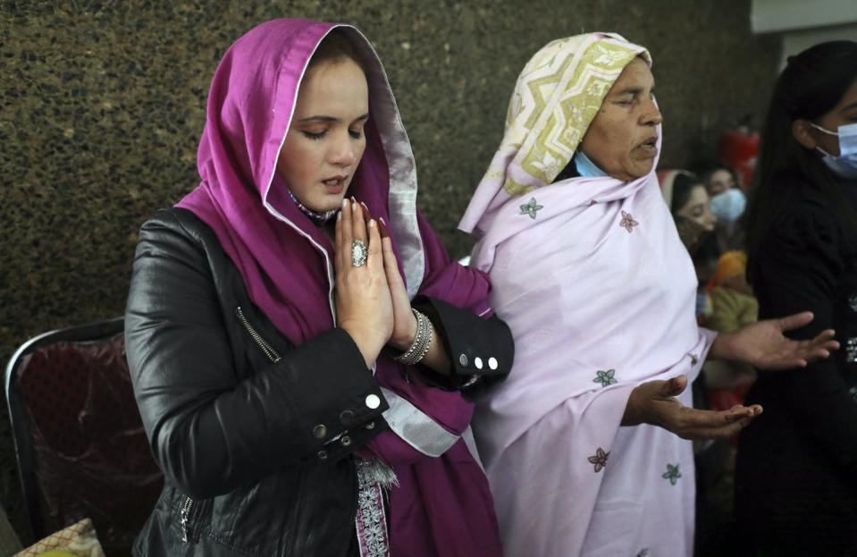 <span class="caption">Christian women pray during a Christmas Mass in Our Lady of Fatima Church in Islamabad, Pakistan, in 2021.</span> <span class="attribution"><a class="link " href="https://newsroom.ap.org/detail/VirusOutbreakPakistanChristmas/a2b52709542e41d4a7cb9c1007e6053d/photo?Query=women%20church%20&mediaType=photo&sortBy=arrivaldatetime:desc&dateRange=Anytime&totalCount=1822&currentItemNo=28" rel="nofollow noopener" target="_blank" data-ylk="slk:AP Photo/Rahmat Gul;elm:context_link;itc:0;sec:content-canvas">AP Photo/Rahmat Gul</a></span>