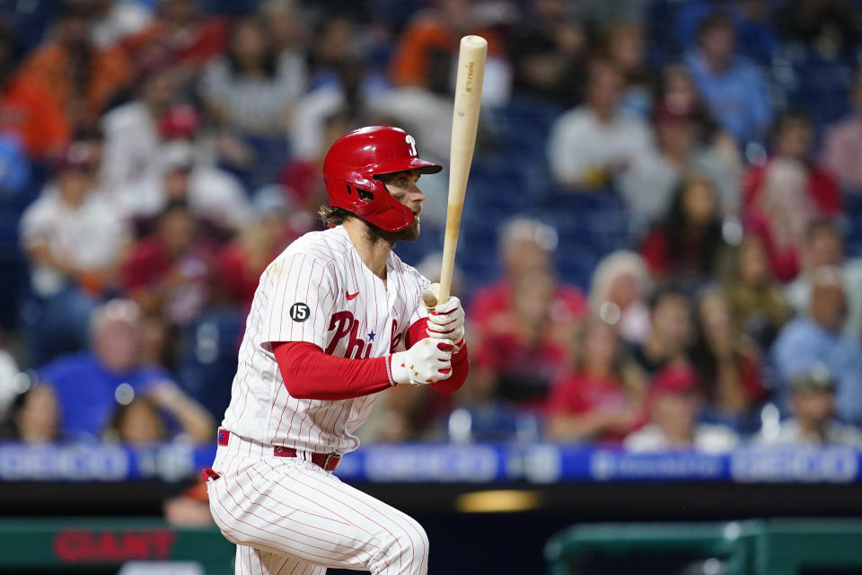 Philadelphia Phillies' Bryce Harper follows through after hitting a single off Baltimore Orioles pitcher Keegan Akin during the sixth inning of an interleague baseball game, Wednesday, Sept. 22, 2021, in Philadelphia. (AP Photo/Matt Slocum)