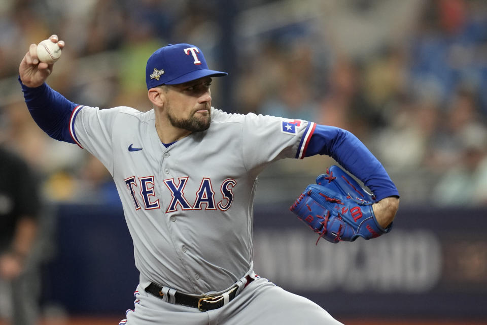 Texas Rangers' Nathan Eovaldi delivers a pitch in the first inning of Game 2 in an AL wild-card baseball playoff series against the Tampa Bay Rays, Wednesday, Oct. 4, 2023, in St. Petersburg, Fla. (AP Photo/John Raoux)