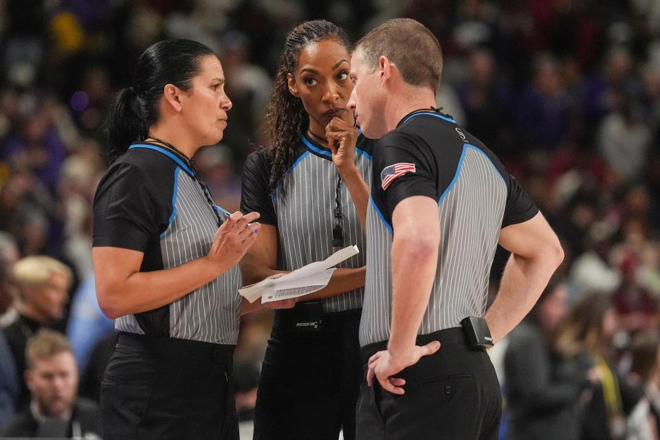 Officials discuss penalties for both South Carolina and LSU during the SEC Tournament championship at Bon Secours Wellness Arena.