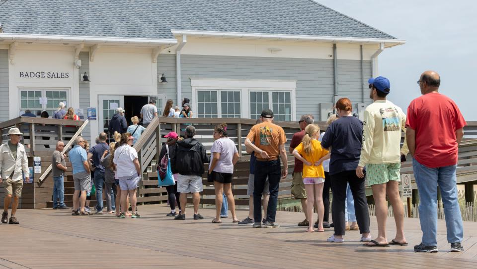 Beach badge buyers lined up by the boardwalk pavilion in Belmar on May 27, 2022.