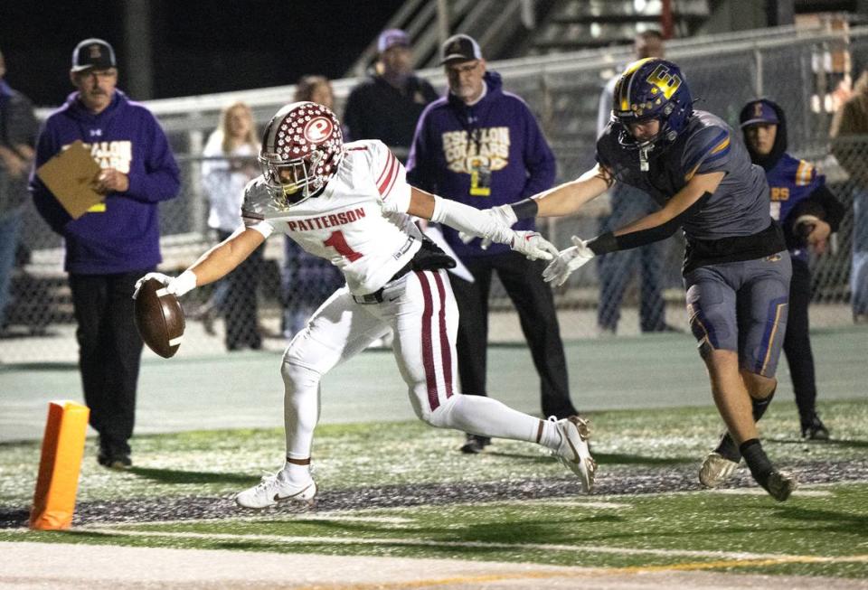 Patterson’s Jeremiah Lugo reaches over the goal line for a touchdown on a run during the Sac-Joaquin Section Division IV championship game with Escalon at St. Mary’s High School in Stockton, Calif., Friday, Nov. 24, 2023.