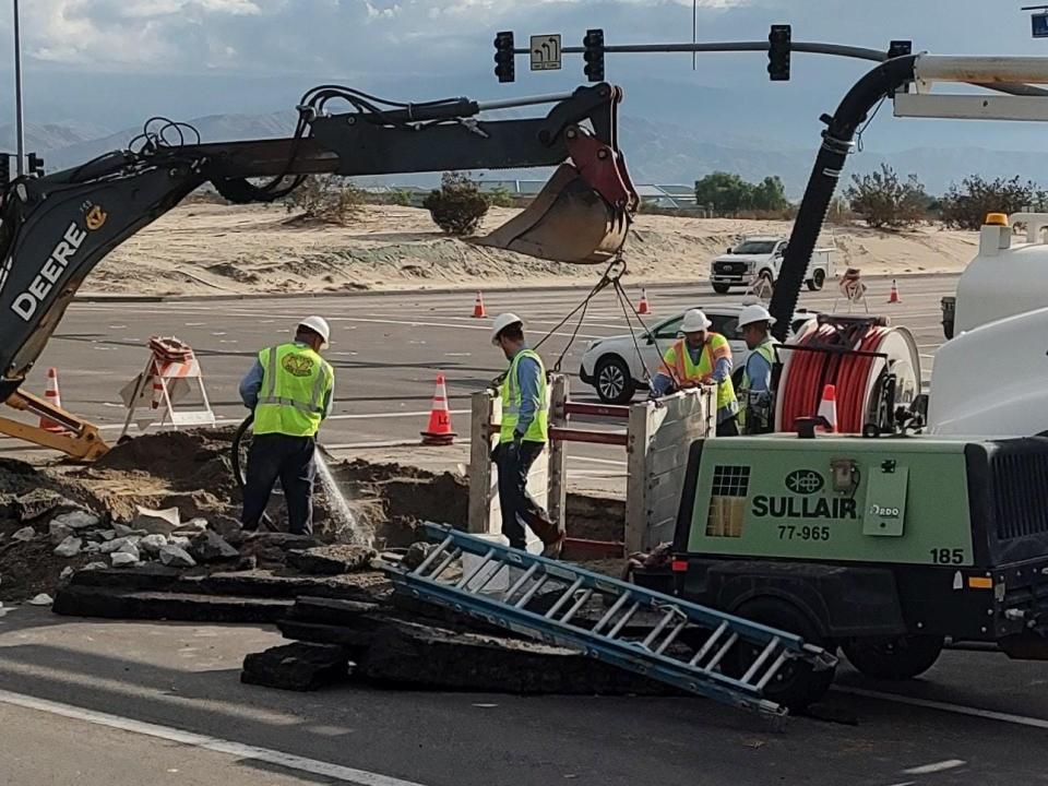 A crew from the Coachella Valley Water District worked Monday morning to repair a large sinkhole at the intersection of Washington Avenue and Fred Waring Drive in Indian Wells on Aug. 21, 2023.