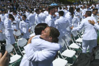 At the conclusion of the U.S. Coast Guard Academy's 141st Commencement Exercises Wednesday, May 18, 2022, in New London, Conn., the cadets have now become ensigns. Vice President Kamala Harris in the commencement speech Wednesday at the academy, reflected on the state of the world in which long-standing rules and norms are more frequently coming under attack, noting the Russian invasion of Ukraine. (AP Photo/Stephen Dunn)