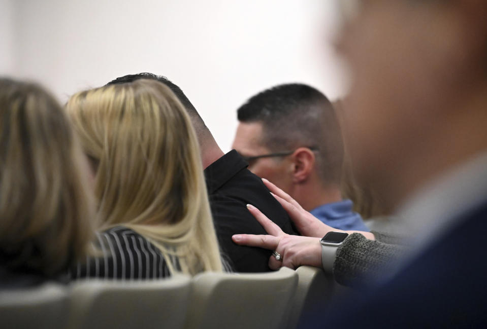 Andrew B. Gillis, father of slain daughter, Kaylin Gillis, is consoled in the courtroom as verdicts are read in Kevin Monahan's murder trial, Tuesday, Jan. 23, 2024, at the Washington County Courthouse in Fort Edward, N.Y. Monahan, 66, was convicted of second-degree murder Tuesday for fatally shooting a young woman when the SUV she was riding in mistakenly drove into his rural driveway in upstate New York. (Will Waldron/The Albany Times Union via AP, Pool)