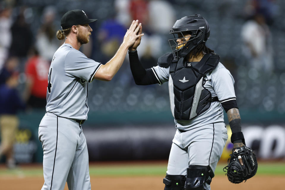 Chicago White Sox pitcher Michael Kopech, left, and catcher Martín Maldonado celebrate a win against the Cleveland Guardians in a baseball game, Tuesday, April 9, 2024, in Cleveland. (AP Photo/Ron Schwane)