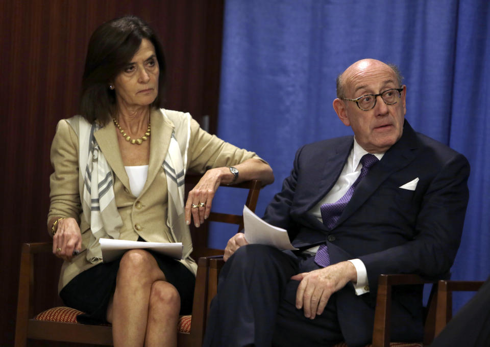 Ken Feinberg and Camille Biros listen as Kelley Hodge addresses a news conference Tuesday Nov. 13, 2018, in Philadelphia. Feinberg and Biros are administrators of claims submitted to the Independent Reconciliation and Reparations Program, a new clergy child sexual abuse victim compensation fund set up by the Roman Catholic Archdiocese of Philadelphia. Hodge serves as part of a three-person Independent Oversight Committee. (AP Photo/Jacqueline Larma)