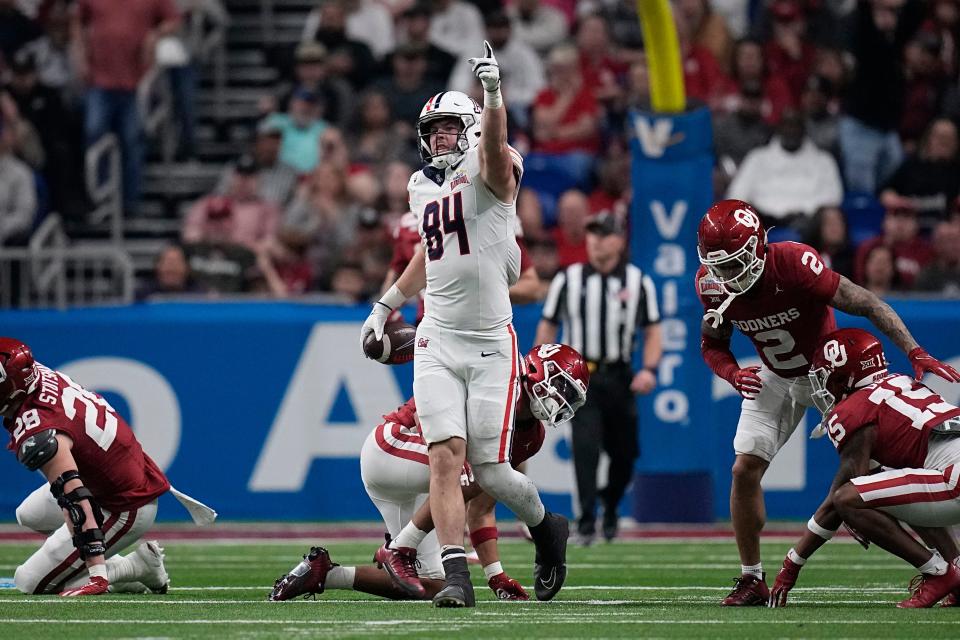Arizona tight end Tanner McLachlan (84) celebrates a catch and first down against Oklahoma during the first half of the Alamo Bowl NCAA college football game in San Antonio, Thursday, Dec. 28, 2023. (AP Photo/Eric Gay) ORG XMIT: TXEG204