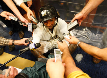 Wearing his "T-Plush" army helmet, Nyjer Morgan talks to reporters after Milwaukee's 3-2 victory over Arizona in Game 5 of the NLDS