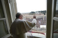 In this photo provided by the Vatican paper L'Osservatore Romano, Pope Francis delivers his Angelus prayer from the window of his studio overlooking St. Peter's Square, at the Vatican, Sunday, March 17, 2013. Breaking with tradition, Pope Francis delivered off-the-cuff remarks about God's power to forgive instead of reading from a written speech for the first Sunday window appearance of his papacy. He also spoke only in Italian, beginning with "buon giorno" (Good day) and ending with "buon pranzo" (Have a good lunch), instead of greeting the faithful in several languages as his last few predecessors had done. (AP Photo/L'Osservatore Romano)