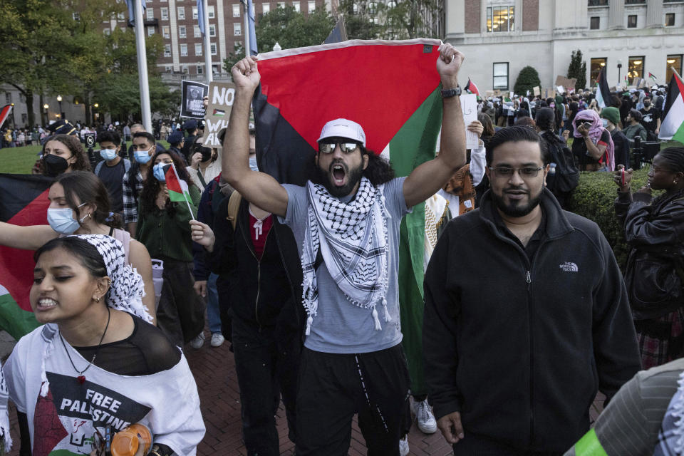 FILE - Palestinian supporters chant as they march during a protest at Columbia University, Thursday, Oct. 12, 2023, in New York. As the death toll rises in the Israel-Hamas war, American colleges have become seats of anguish with many Jewish students calling for strong condemnation after civilian attacks by Hamas while some Muslim students are pressing for recognition of decades of suffering by Palestinians in Gaza. (AP Photo/Yuki Iwamura, File)