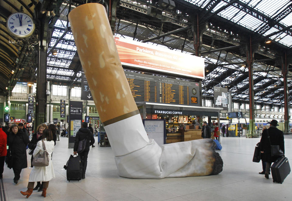 A symbolic cigarette butt is set up inside Gare de Lyon railway station, in Paris, Tuesday Dec. 4, 2012, as part of a publicity campaign against rudeness, by Paris's public transport authority. The possibility of apparent rudeness is being counteracted by an advertising campaign as tourism companies and the Paris transport authority address concerns of tourists during the financial crisis. (AP Photo/Remy de la Mauviniere)