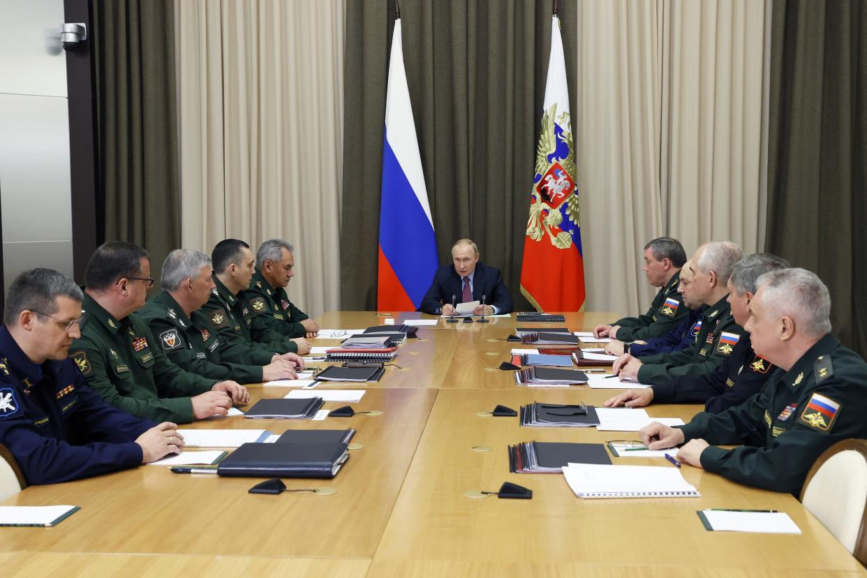 Russian President Vladimir Putin, center, speaks during a meeting with Defense Ministry high level officials and heads of defense industry at the Bocharov Ruchei residence in the Black Sea resort of Sochi, Russia, Wednesday, Nov. 3, 2021. (Mikhail Metzel, Sputnik, Kremlin Pool Photo via AP)