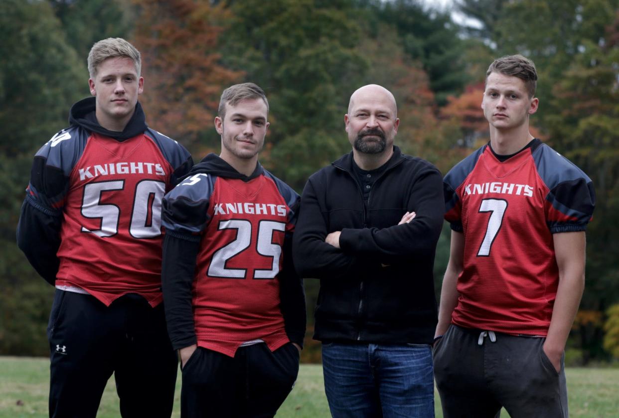 Ghost hunter, Jason Hawes with his three sons on Oct 28, 2021.  L to r Austin, Logan and Connor at Exeter/West Greenwich HS where they are all members of the football team.    [The Providence Journal / Kris Craig]