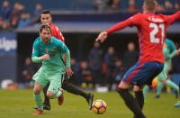 Football Soccer - Osasuna v Barcelona - Spanish La Liga Santander - El Sadar, Pamplona, Spain - 10/12/2016 Barcelona's Lionel Messi fights for the ball. REUTERS/Vincent West