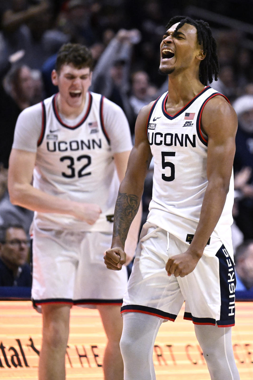 UConn guard Stephon Castle (5) and UConn center Donovan Clingan (32) react in the second half of an NCAA college basketball game against Creighton, Wednesday, Jan. 17, 2024, in Stores, Conn. (AP Photo/Jessica Hill)