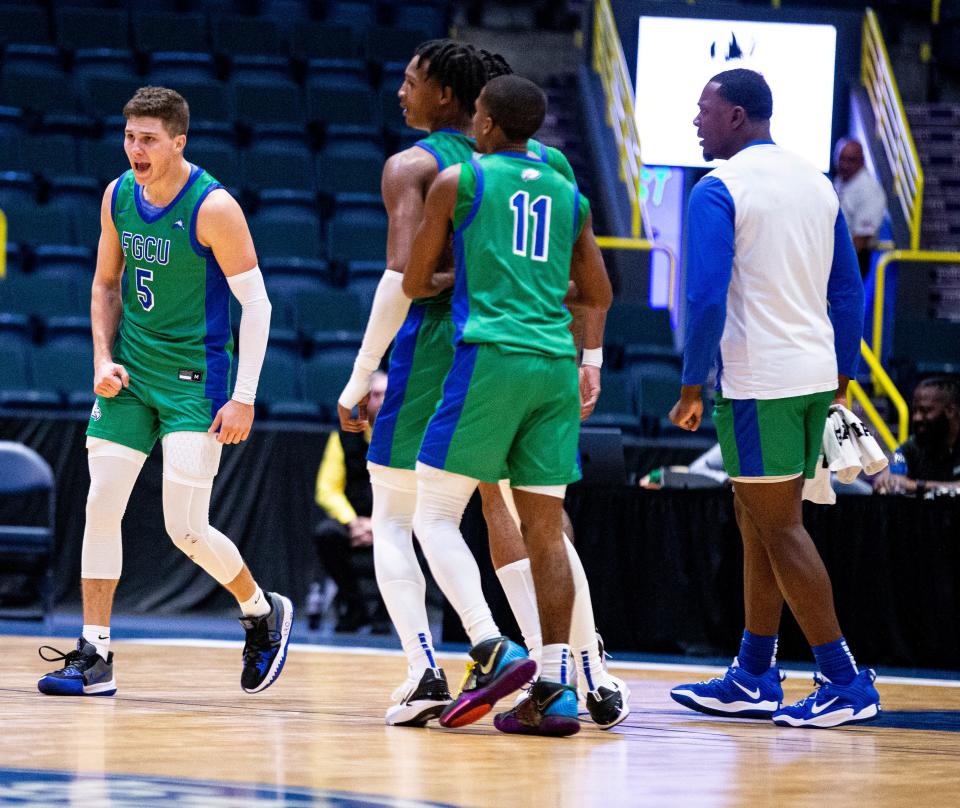 FGCUÕs  Chase Johnston celebrates a three against Northern Kentucky at the Gulf Coast Showcase at Hertz Arena. FGCU won and moves on to play Drexel.  
