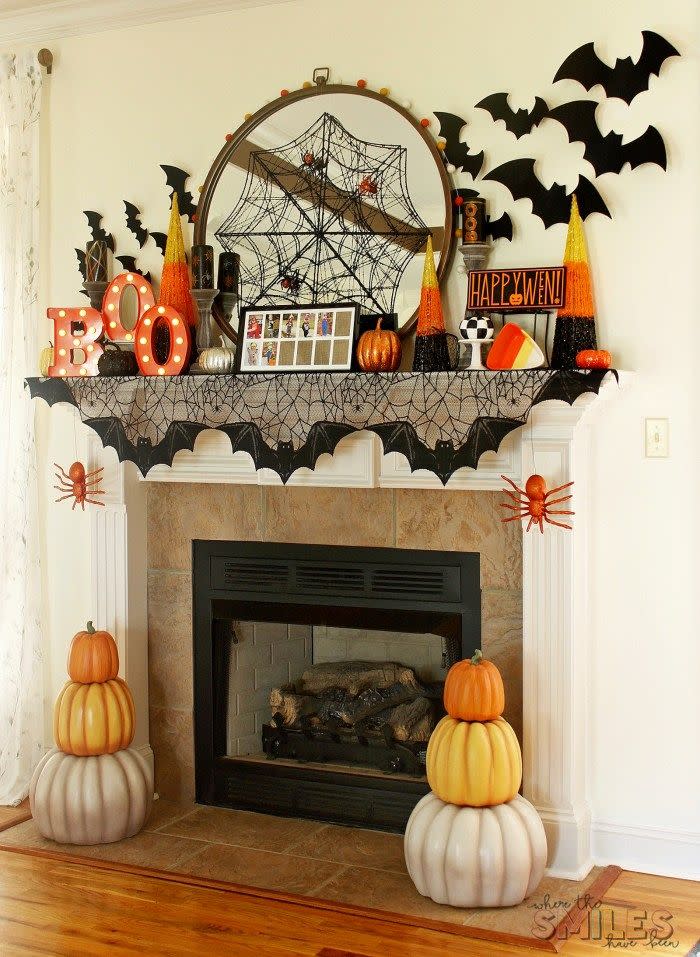 <p>There's a lot going on around this joyous mantel, which is literally bursting with seasonal fun. We especially love the clever spiderweb (with spiders) spun over the mirror and bats taking flight around the space. Pumpkin topiaries that can stay up through Thanksgiving flank the fire box.</p><p><strong>See more at <a href="https://www.wherethesmileshavebeen.com/halloween-mantel-decor/" rel="nofollow noopener" target="_blank" data-ylk="slk:Where the Smiles Have Been;elm:context_link;itc:0;sec:content-canvas" class="link ">Where the Smiles Have Been</a>.</strong></p>