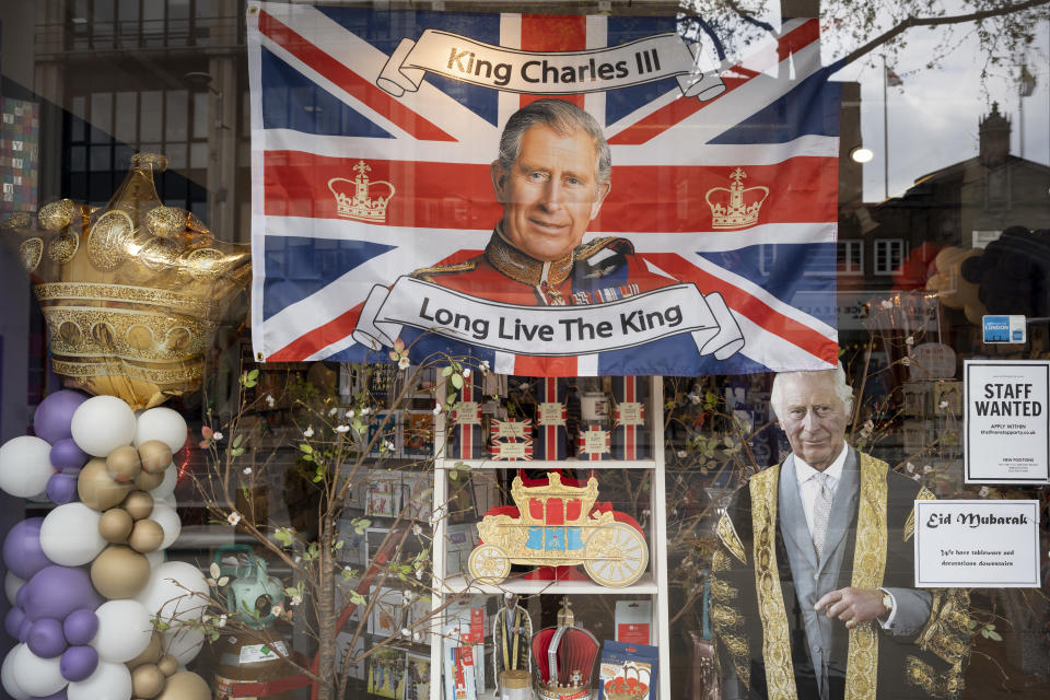 Before the coronation of King Charles III takes place, his face and other royal merchandise are on display in the window of a party and balloon shop business in London.