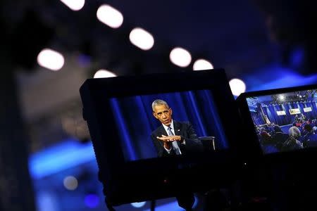 U.S. President Barack Obama is seen on a television monitor as he attends a town hall interview with ESPN anchor Stan Verrett (not pictured) on "sports, race and achievements" at North Carolina Agricultural and Technical State University in Greensboro, North Carolina, U.S. October 11, 2016. REUTERS/Carlos Barria