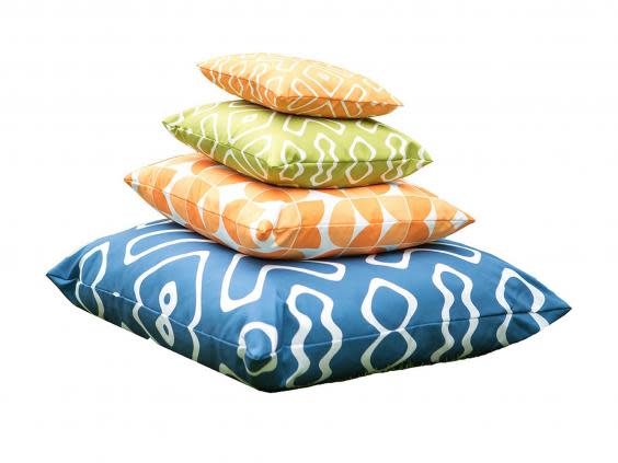 Stay comfortable when sitting on a picnic blanket by adding fluffy outdoor cushions (We Love Cushions)