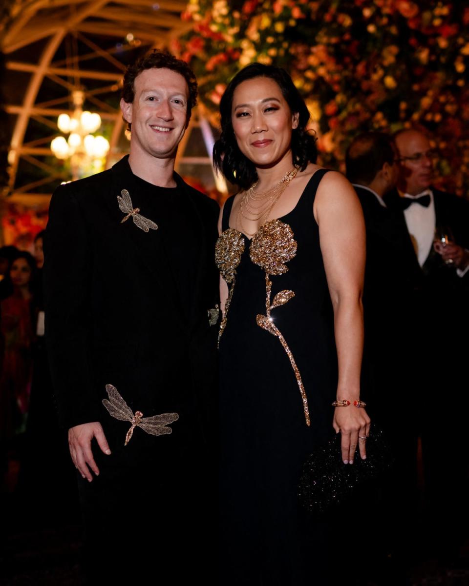 Meta chief Mark Zuckerberg (L) with his wife Priscilla Chan attending a three-day pre-wedding celebration in India (Reliance/AFP via Getty Images)