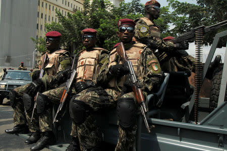 Soldiers of Ivory Coast presidential guard patrol as they arrive at the port of Abidjan, Ivory Coast January 18, 2017. REUTERS/Luc Gnago