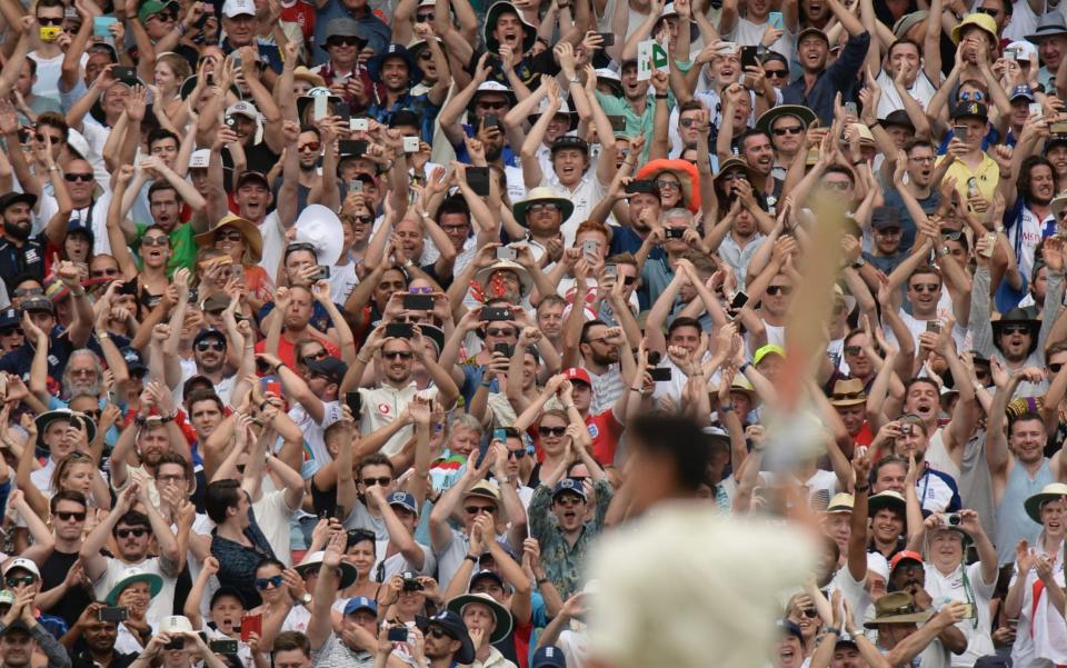 England fans clap after Alastair Cook reached two hundred during the third day of the fourth Ashes cricket test match between Australia and England at the Melbourne Cricket Ground on December 28, 2017 in Melbourne, Australia - Philip Brown/Getty Images