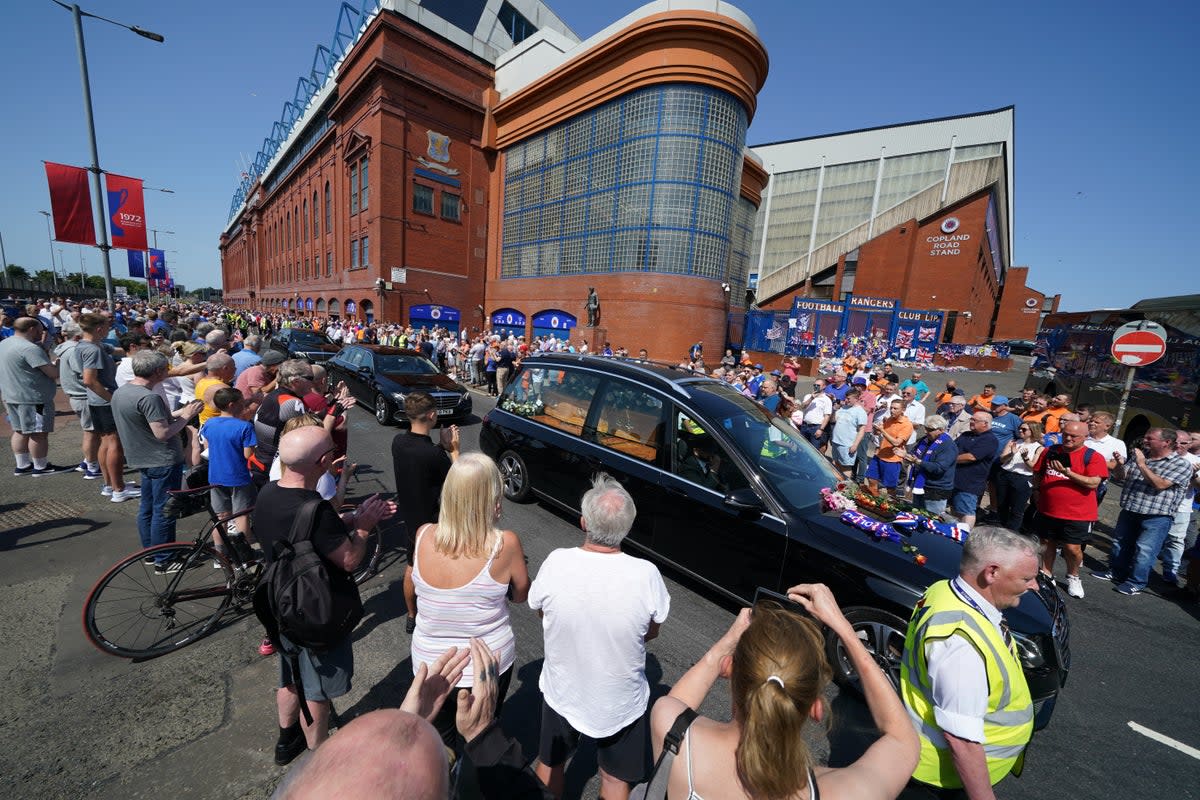 Crowds watched the funeral cortege pass Ibrox stadium (Andrew Milligan/PA) (PA Wire)