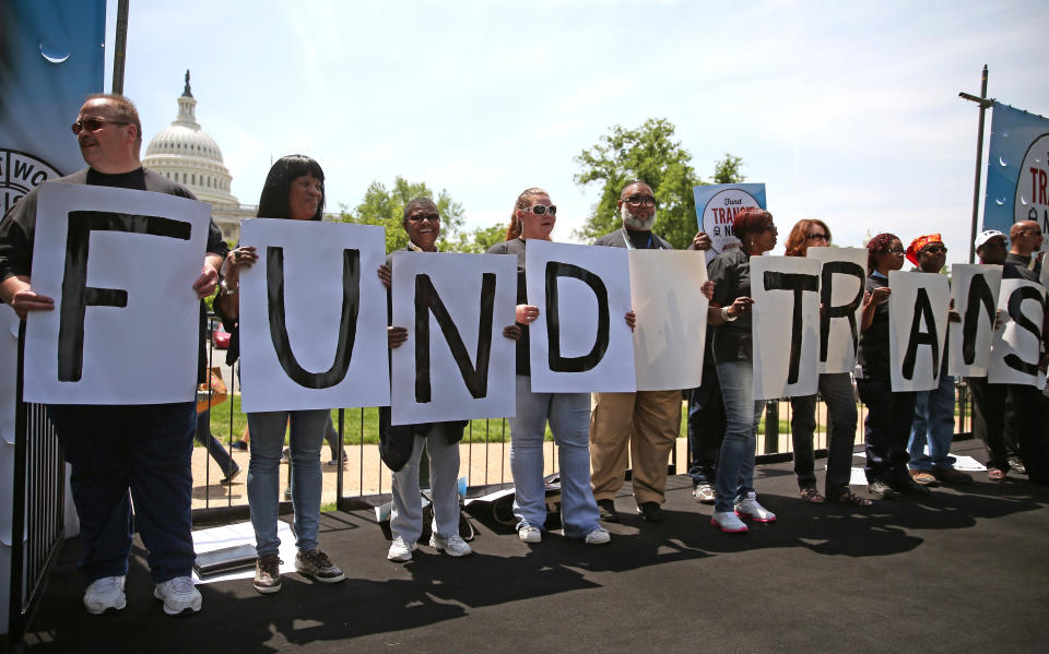 WASHINGTON, DC - MAY 20:  Transit workers participate in a rally to urge Congress to replenish the Highway Trust Fund, on Capitol Hill, May 20, 2014 in Washington, DC. Workers say that the pending highway bill is about more about mass transit and jobs and not just highways.  (Photo by Mark Wilson/Getty Images)