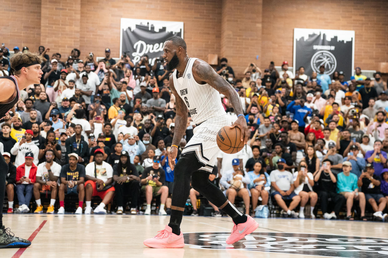 LOS ANGELES, CALIFORNIA - JULY 16: LeBron James handles the ball at the Drew League Pro-Am on July 16, 2022 in Los Angeles, California. (Photo by Cassy Athena/Getty Images)