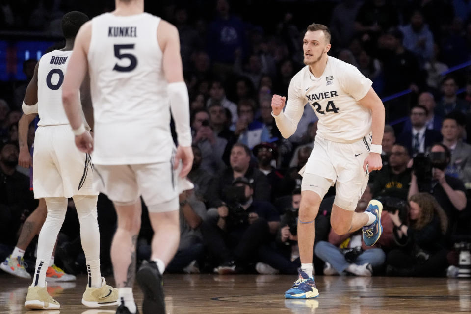 Xavier's Jack Nunge (24) reacts after scoreing the go-ahead two point shot in the second half of an NCAA college basketball game against DePaul during the quarterfinals of the Big East conference tournament, Thursday, March 9, 2023, in New York. (AP Photo/John Minchillo)
