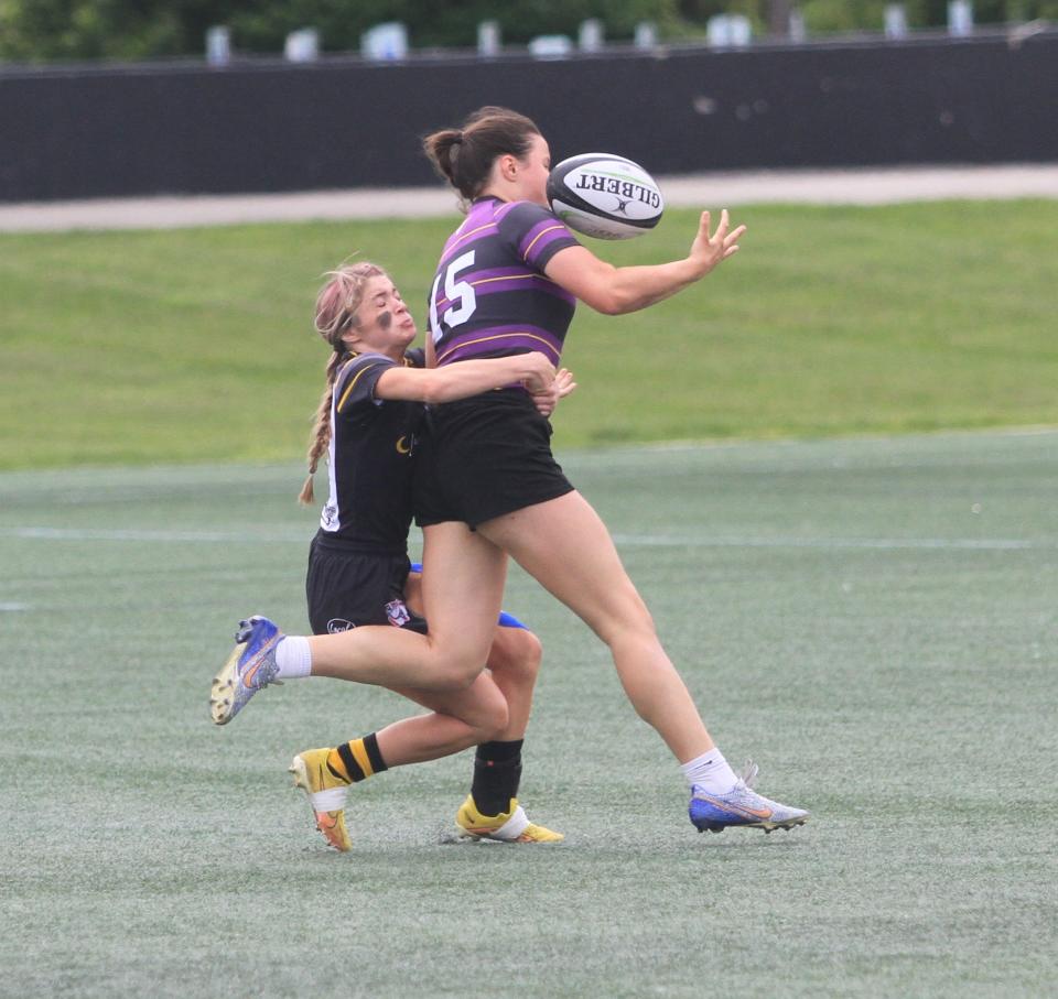 Maddi VanHoose makes a try-saving tackle and jars the ball loose for Warrior Rugby during a 30-0 loss to top-seeded Saint Joseph Academy in the Single School Girls state semifinal at Fortress Obetz on Sunday, May 28, 2023.