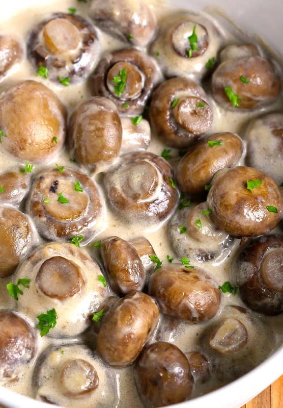<p>Cakes Cottage</p><p>These creamy garlic mushrooms are incredible and is by far one of the easiest mushroom side dishes you'll make!</p><p><strong>Get the recipe: <a href="https://cakescottage.com/2016/07/23/creamy-garlic-mushrooms/" rel="nofollow noopener" target="_blank" data-ylk="slk:Creamy Garlic Mushrooms;elm:context_link;itc:0;sec:content-canvas" class="link ">Creamy Garlic Mushrooms</a></strong></p>