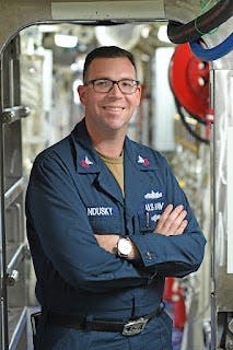 Petty Officer 1st Class Tanner Sandusky, a native of Brighton, Michigan, serves in Japan aboard a forward-deployed U.S. Navy warship.