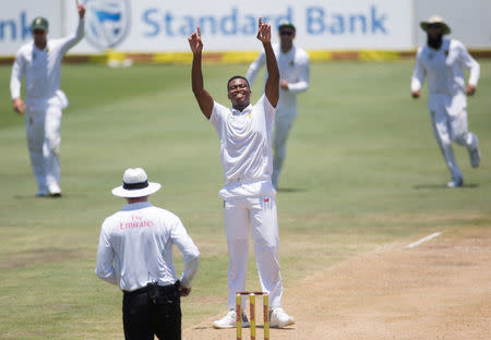 Cricket - India v South Africa - Second Test match - Centurion Stadium, Pretoria, South Africa - January 17, 2018. South Africa's Lungi Ngidi celebrates taking the wicket of India’s Jasprit Bumrah. REUTERS/James Oatway